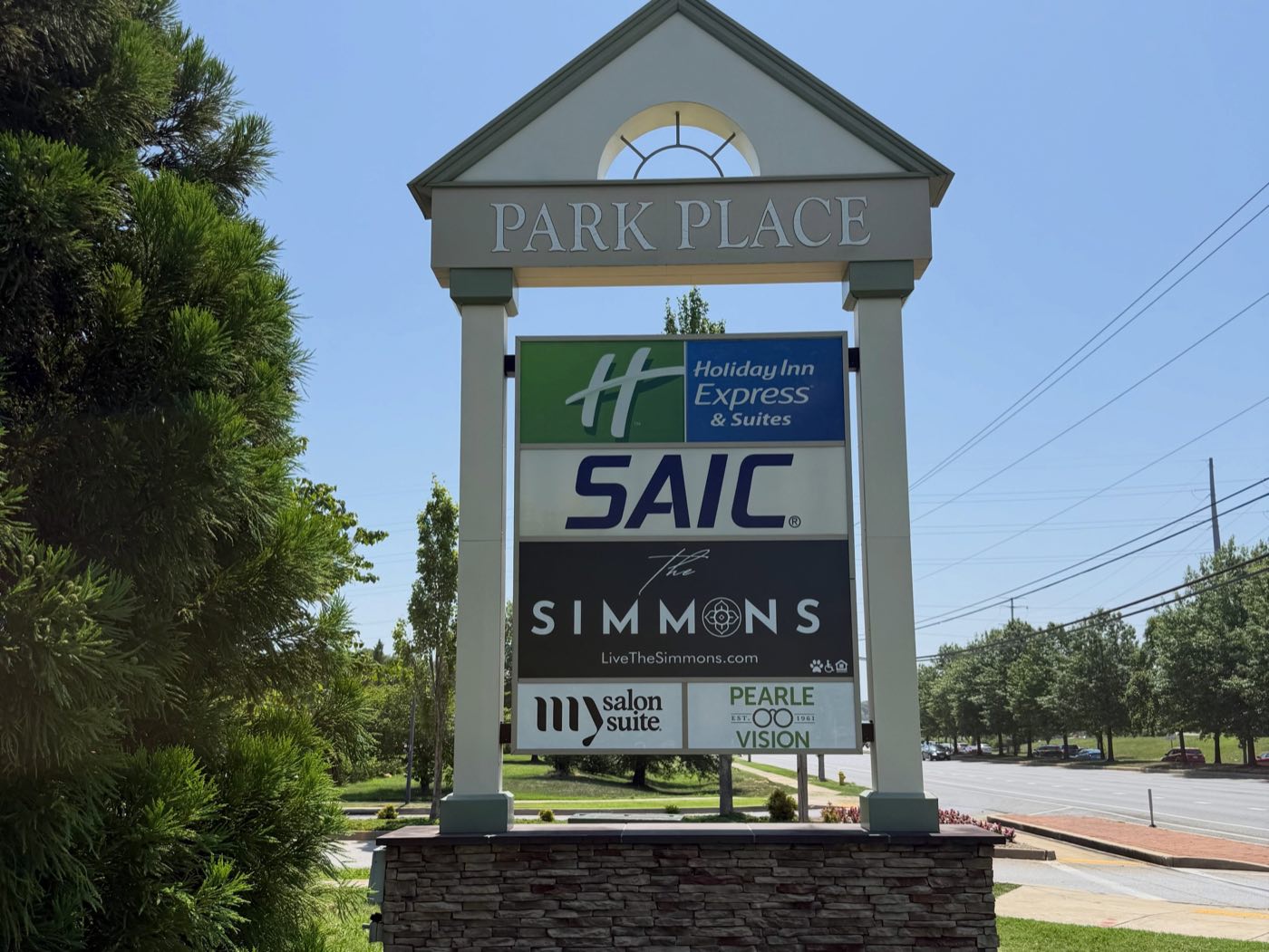 The Park Place monument sign listing tenants of the development, including The Simmons